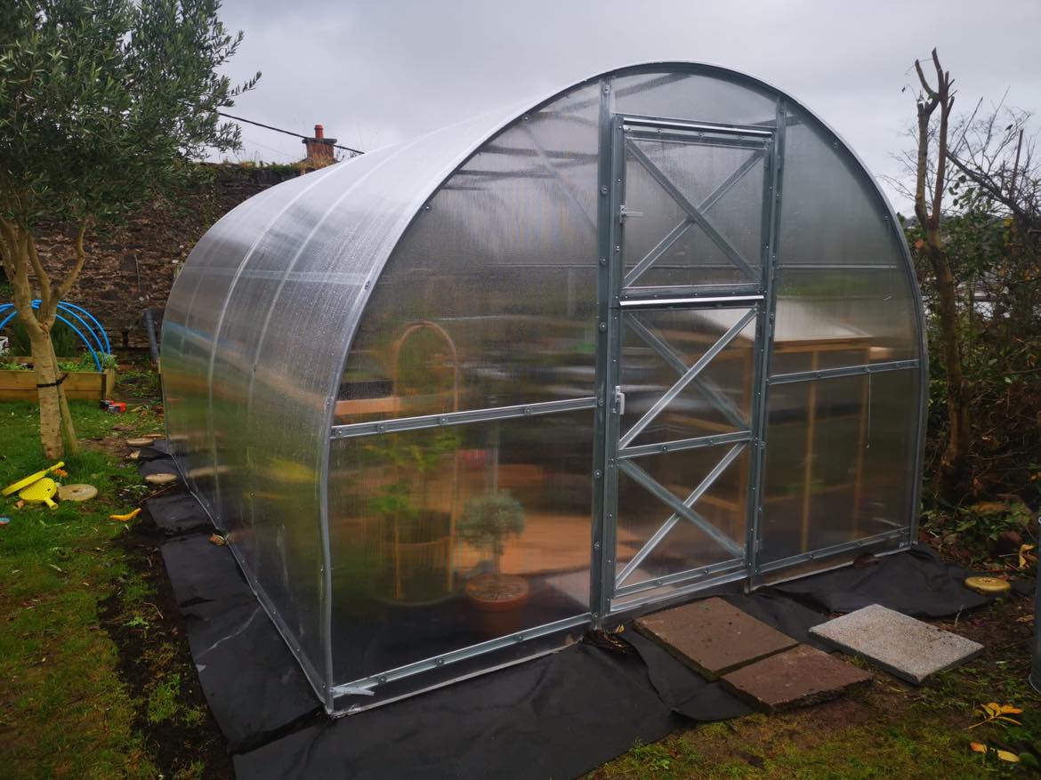 How to Grow Food Year-Round in a Greenhouse