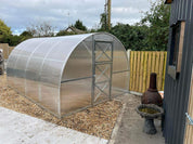 Premium polycarbonate greenhouse with galvanized steel frame on gravel foundation